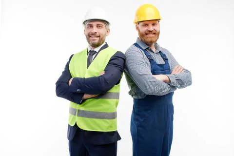 Engineer and foreman looking at camera on white background Stock Photos