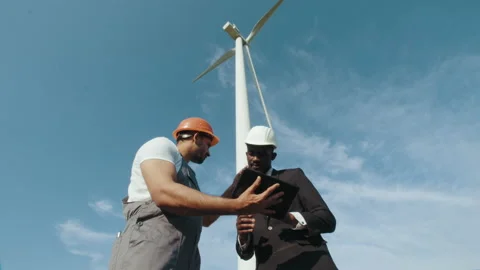 Engineer and inspector working together on windmill farm. Indian engineer in Stock Footage 170333647