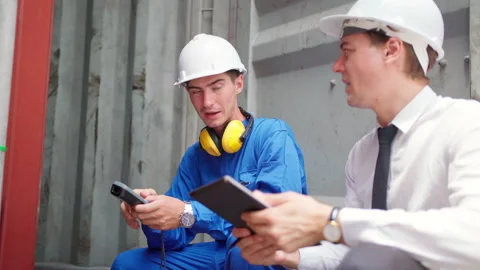 Engineer and manager check quality of container using barcode scanning Stock Footage 202134502