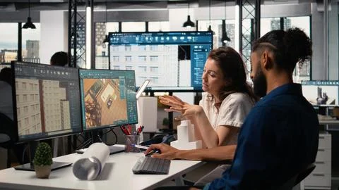 Engineer and property developer working with architectural design software Foto stock
