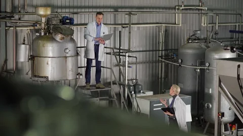 Engineer and quality control expert checking factory equipment Video stock 127705141