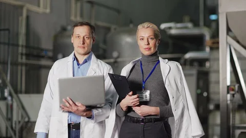 Engineer and quality control expert posing in factory Stock Footage 127705340