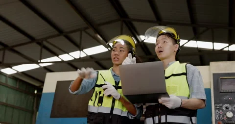 Engineer and technician are checking the machine in factory. Stock Footage 168940680