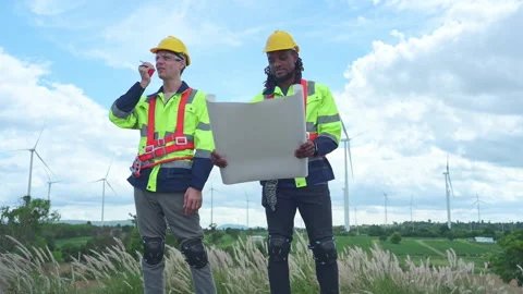 Engineer and technician discussing a solution problem of wind turbine Video stock 253982796