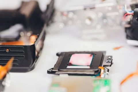 Engineer and technician Minitures are fixing camera mirror box assembly Stock Photos