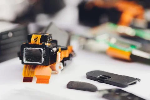 Engineer and technician Minitures are fixing camera mirror box assembly Stock Photos