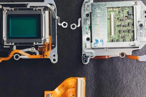 Engineer and technician Minitures are fixing camera mirror box assembly Stock Photos