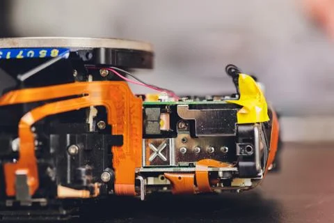 Engineer and technician Minitures are fixing camera mirror box assembly Stock Photos