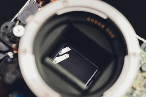 Engineer and technician Minitures are fixing camera mirror box assembly Stock Photos