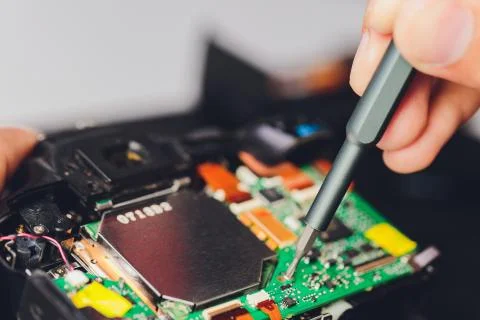 Engineer and technician Minitures are fixing camera mirror box assembly Stock Photos