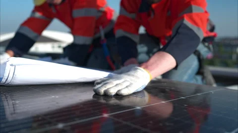 Engineer and technician working on the solar panel on the warehouse Stock Footage 260233620