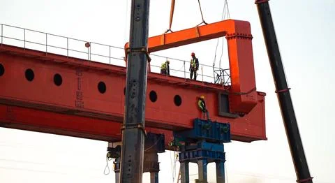 Engineer and worker are working build sky hiway on crane construction. Stock Photos