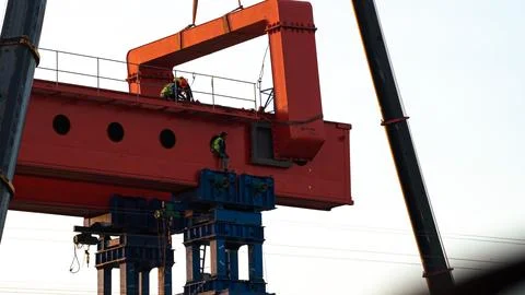 Engineer and worker are working build sky hiway on crane construction. Stock Photos