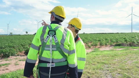 Engineer and worker discussing the project on the background Stock Footage 253988895