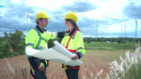 Engineer and worker discussing the project on the background Stock Footage 253998613