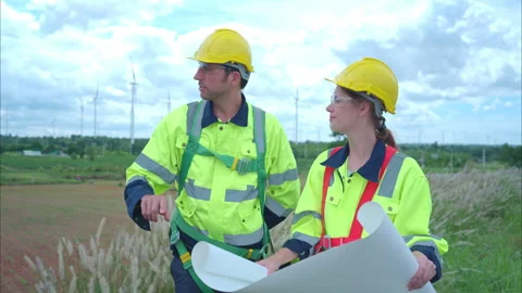 Engineer and worker discussing the project on the background Stock Footage 254003939