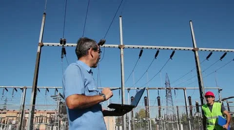 Engineer and Worker at Electrical Substation - Teamwork Stock Footage 12535344