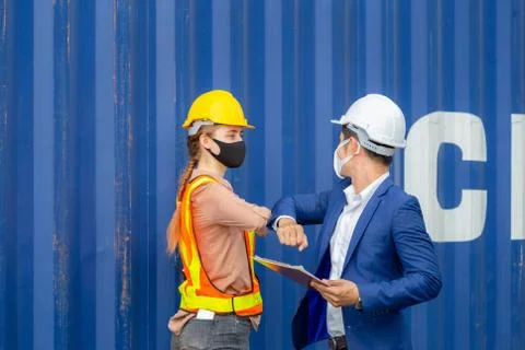 Engineer and worker shaking elbows, New novel greeting to avoid the spread Photos