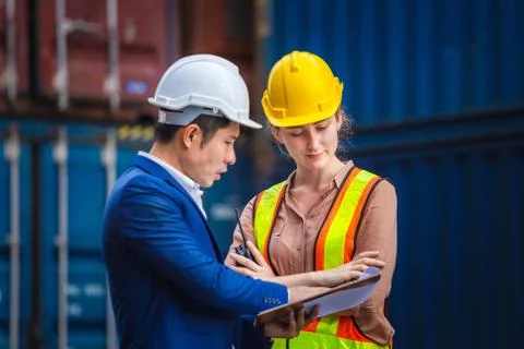 Engineer and worker team checking containers box from cargo, Logistic and tea Photos