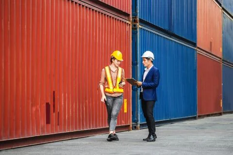 Engineer and worker team checking containers box from cargo, Logistic and tea Фото