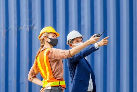 Engineer and worker team checking containers box from cargo, Logistic and tea Photos