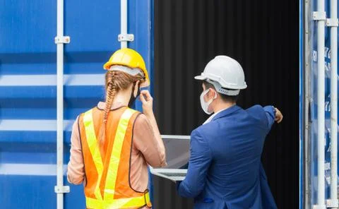 Engineer and worker team checking containers box from cargo, Logistic and team 库存照片
