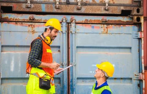Engineer and worker team checking containers box from cargo, Happiness and Te Фото