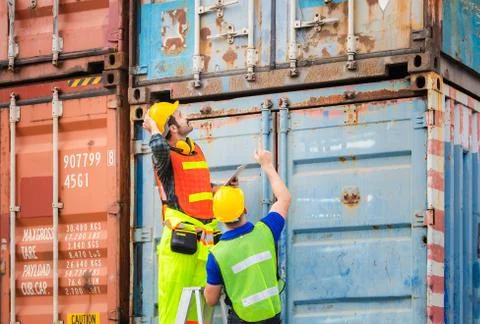 Engineer and worker team checking containers box from cargo, Teamwork concept Фото