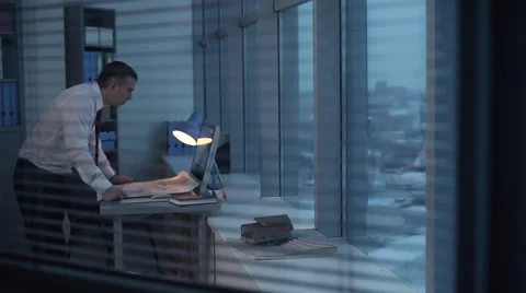 Engineer, Architect Stays Late at the Office Stock Footage 62370939