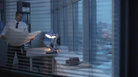 Engineer, Architect Stays Late at the Office Stock Footage 62370962
