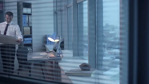 Engineer, Architect Stays Late at the Office Stockbeeldmateriaal 70864139