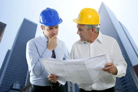 Engineer architect two expertise team plan hardhat Stock Photos