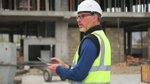 Engineer architect using digital tablet and pen at construction site Stock Footage 274412010