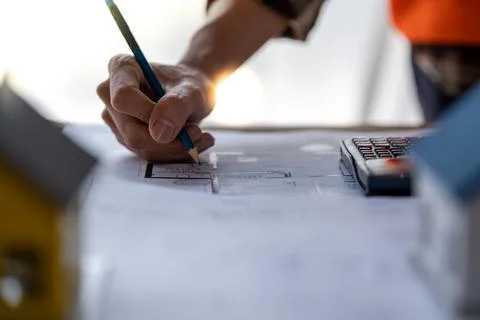 Engineer are helping to design work on blueprints, engineer people meeting Stock Photos