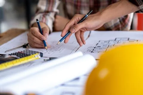 Engineer are helping to design work on blueprints, engineer people meeting Stock Photos