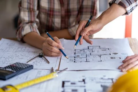 Engineer are helping to design work on blueprints, engineer people meeting 스톡 사진