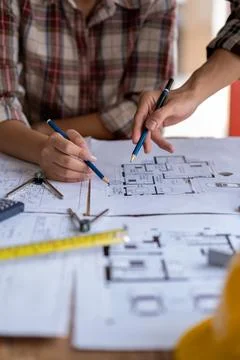 Engineer are helping to design work on blueprints, engineer people meeting Stock Photos