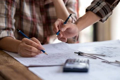 Engineer are helping to design work on blueprints, engineer people meeting Stock Photos