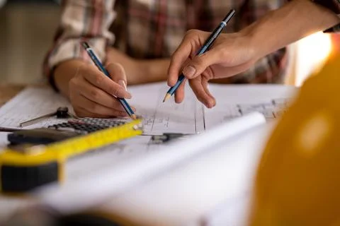 Engineer are helping to design work on blueprints, engineer people meeting Stock Photos