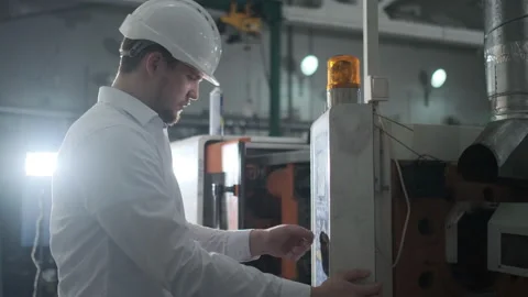 Engineer are Setting Up CNC Lathe Machine Stock Footage 114503845