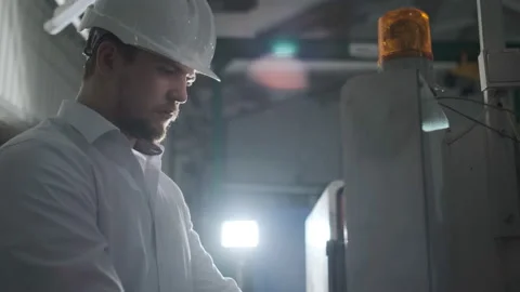 Engineer are Setting Up CNC Lathe Machine Stock Footage 114504208