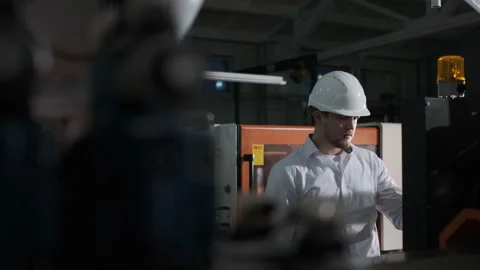 Engineer are Setting Up CNC Lathe Machine Stock Footage 114504923