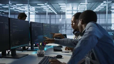 Engineer arrives in data center, puts headphones on, implementing AI systems Stock Photos