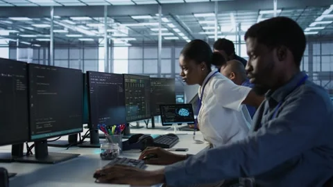 Engineer arriving in data center, saluting colleagues Stock Footage 319576245