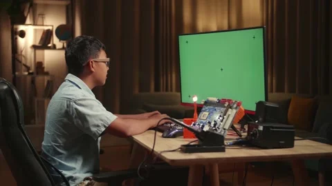 Engineer Asian Boy Is Working With Desktop Computer In Home, Mock Up Green Stock Footage 158693168
