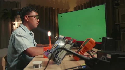 Engineer Asian Boy Is Working With Desktop Computer In Home, Mock Up Green Stock Footage 158693776
