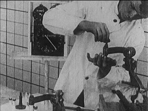 An engineer assembles a piece of machinery quickly and efficiently in the Stock Footage 75276680