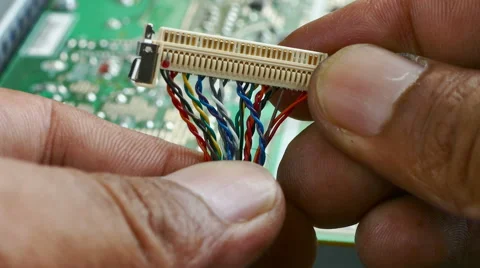 Engineer assembly electronic device connect wire to pin of main board Stock Footage 69060676