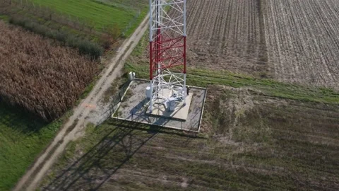 Engineer beside 5G telecom tower checking the connectivity on his tablet. Stock Footage 143820845