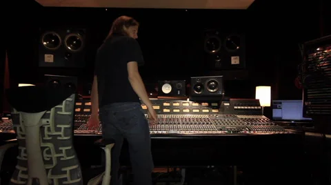 Engineer in big studio adjusting gear Video stock 52684061